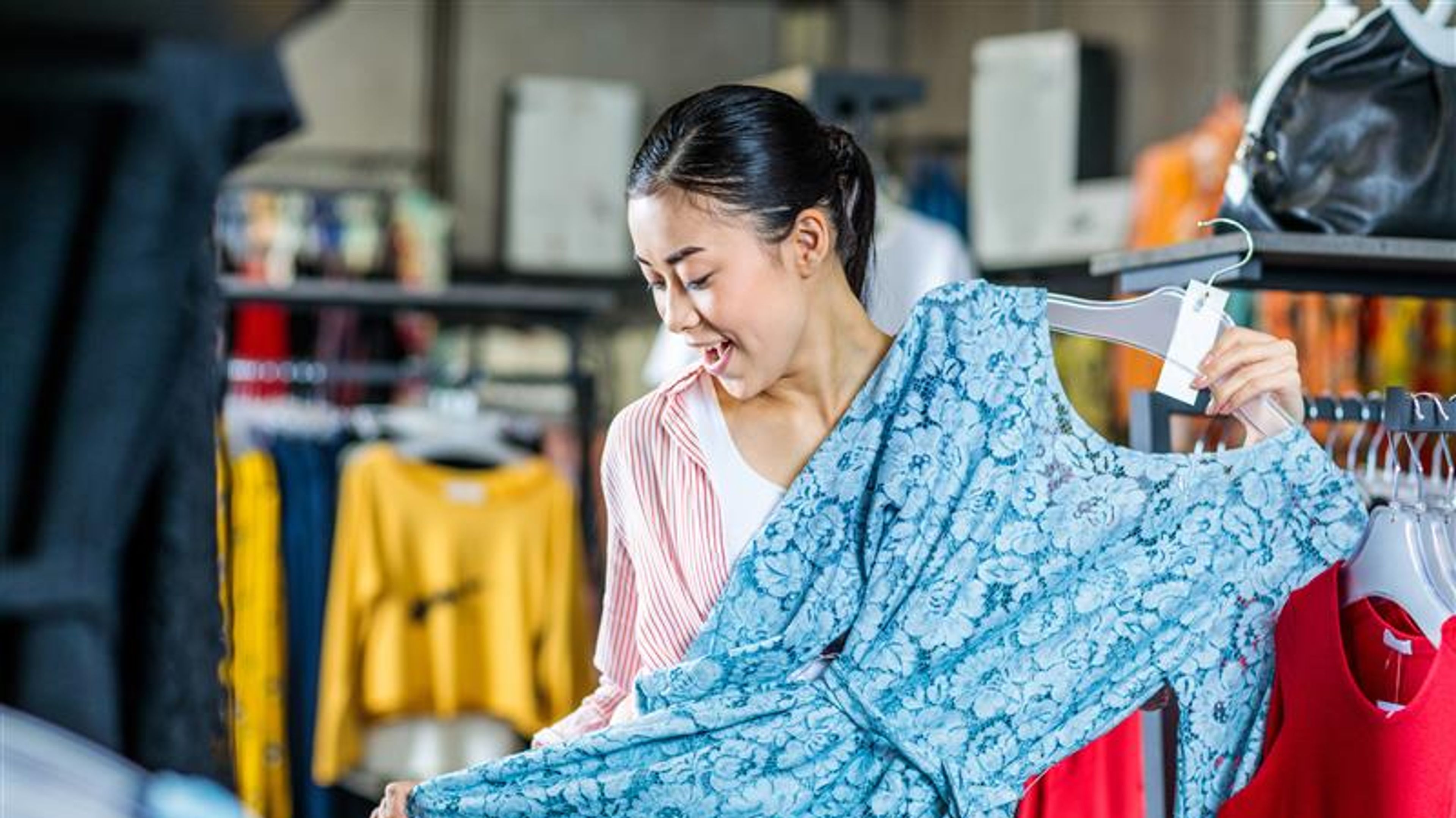 A Bangladesh woman select dress from store