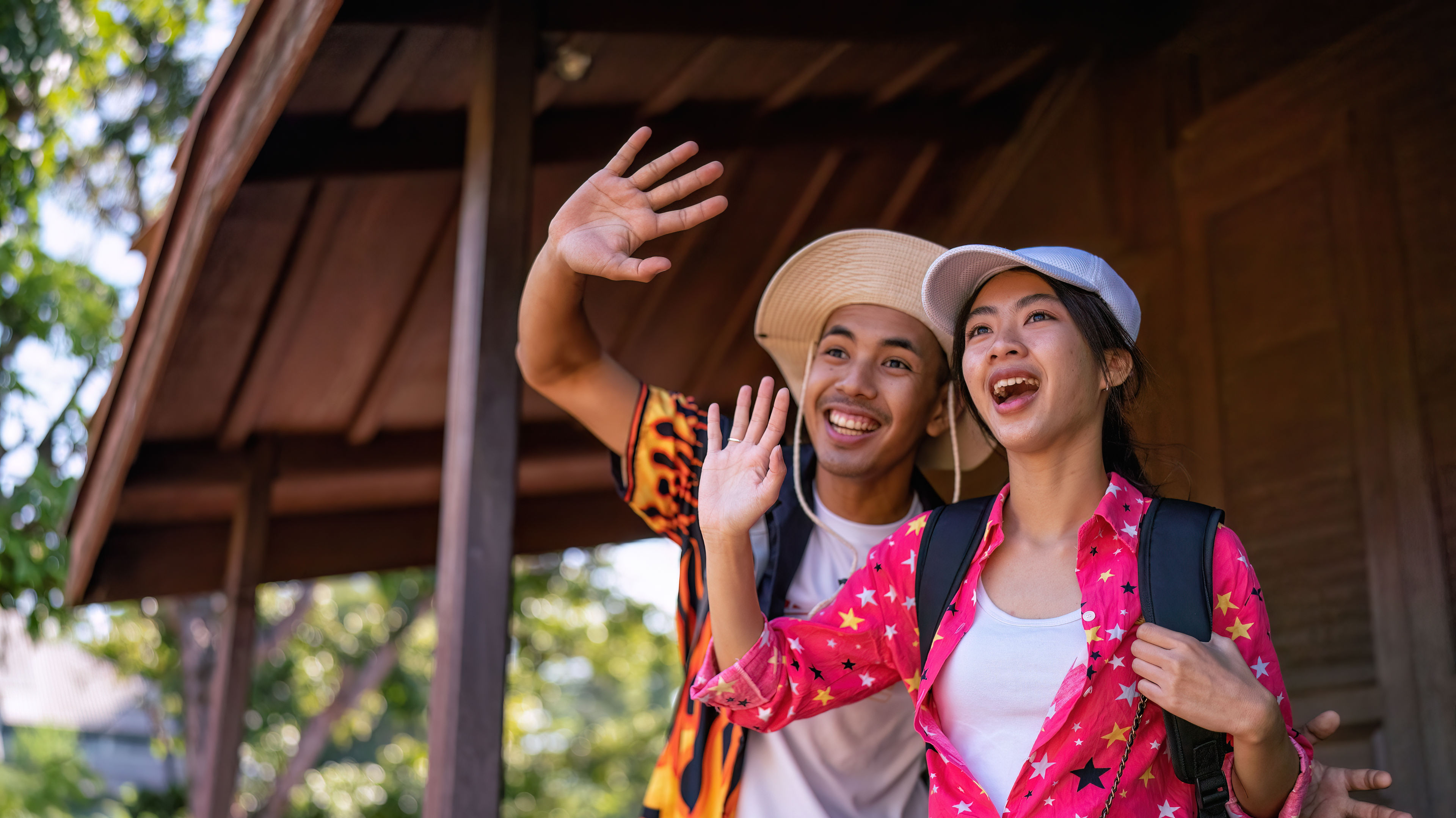 Traveler tourist man and women with backpack walking in historical place temple Ayuttaya Thailand