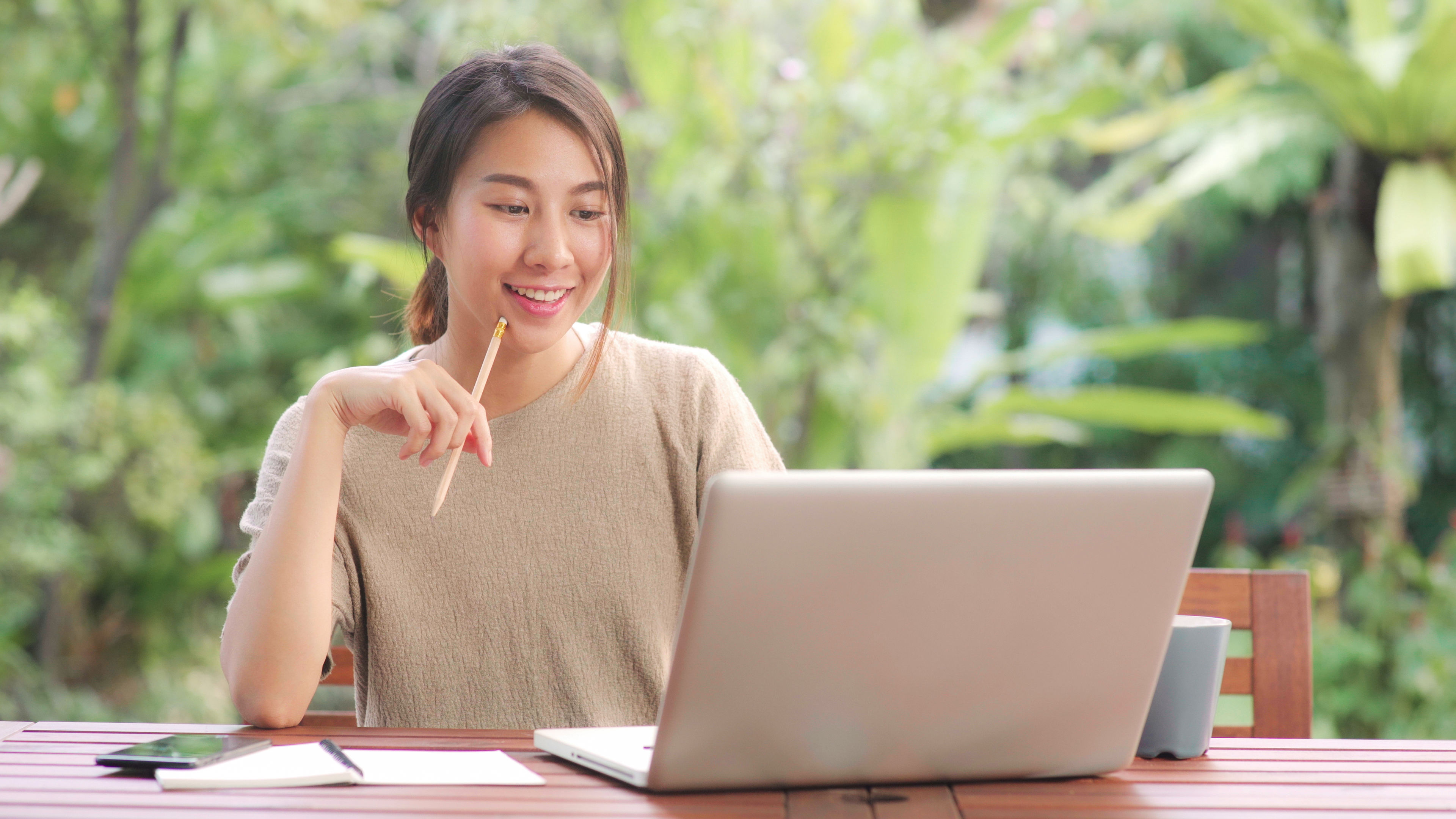 Woman looking at laptop