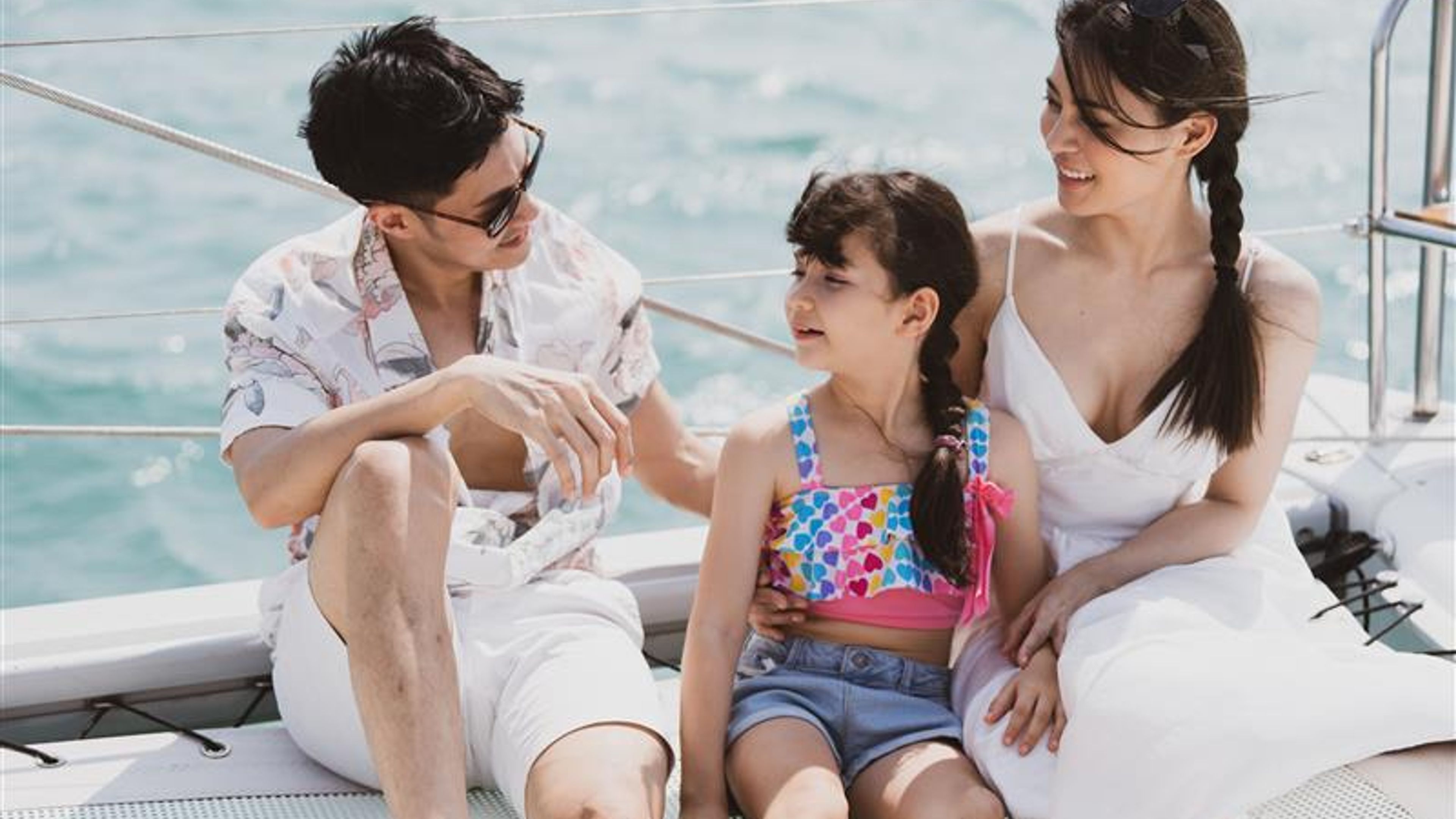 A happy family enjoying a boat ride