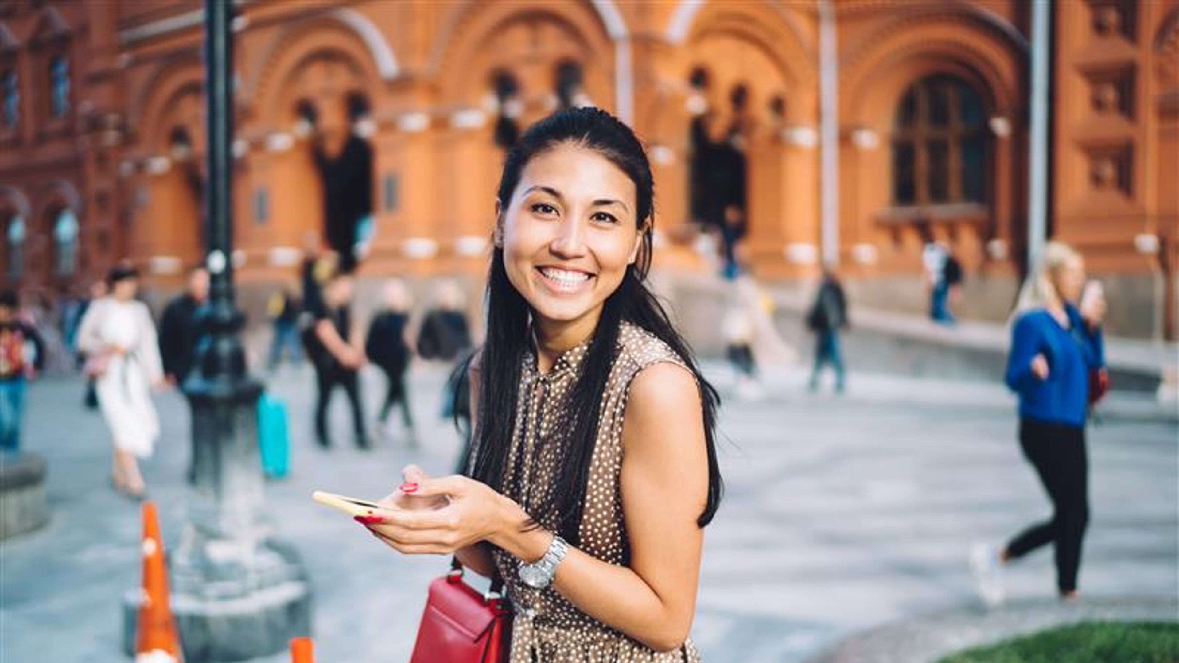 A woman happily enjoying a solo trip