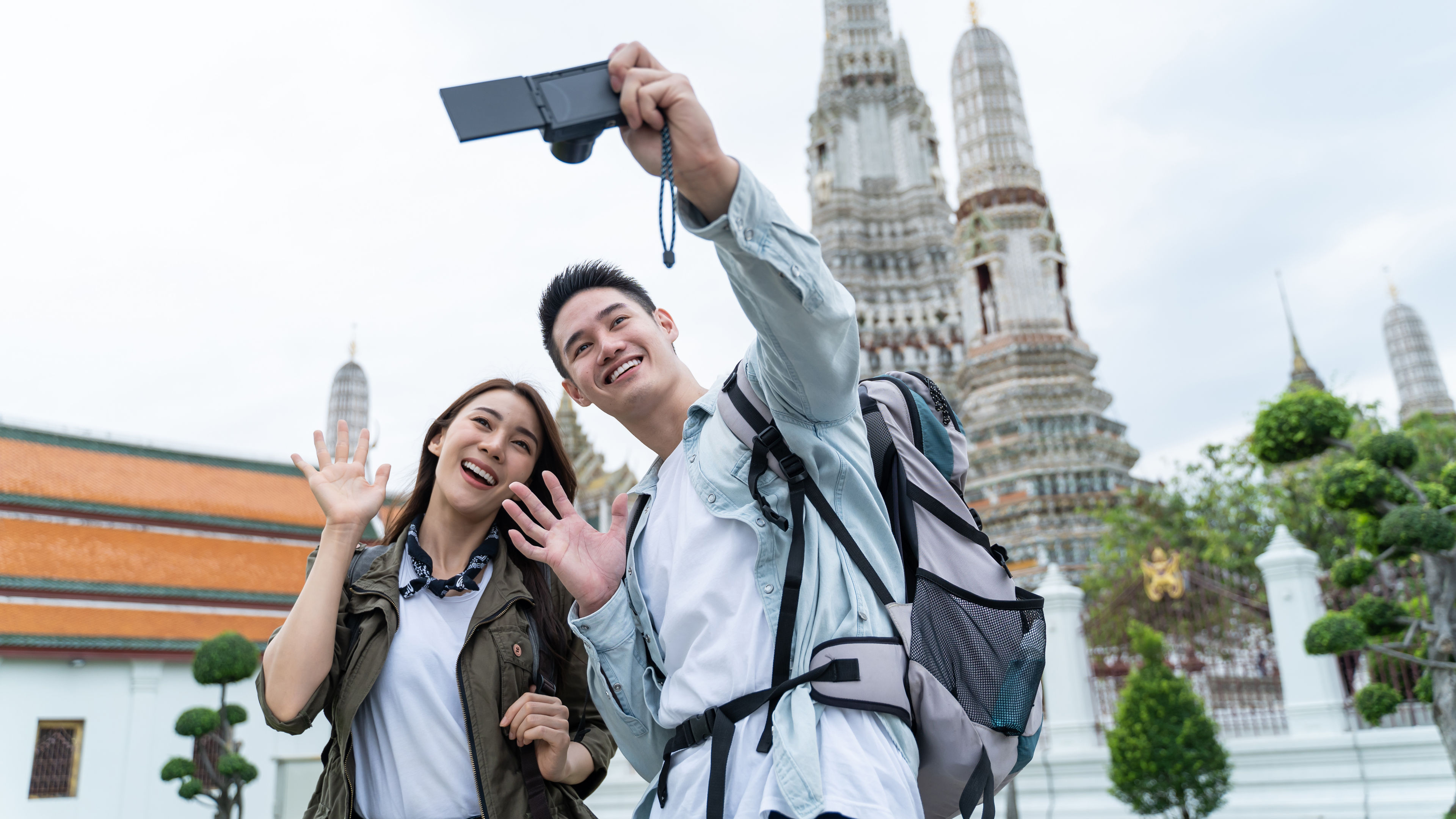 A young couple is taking a selfie together