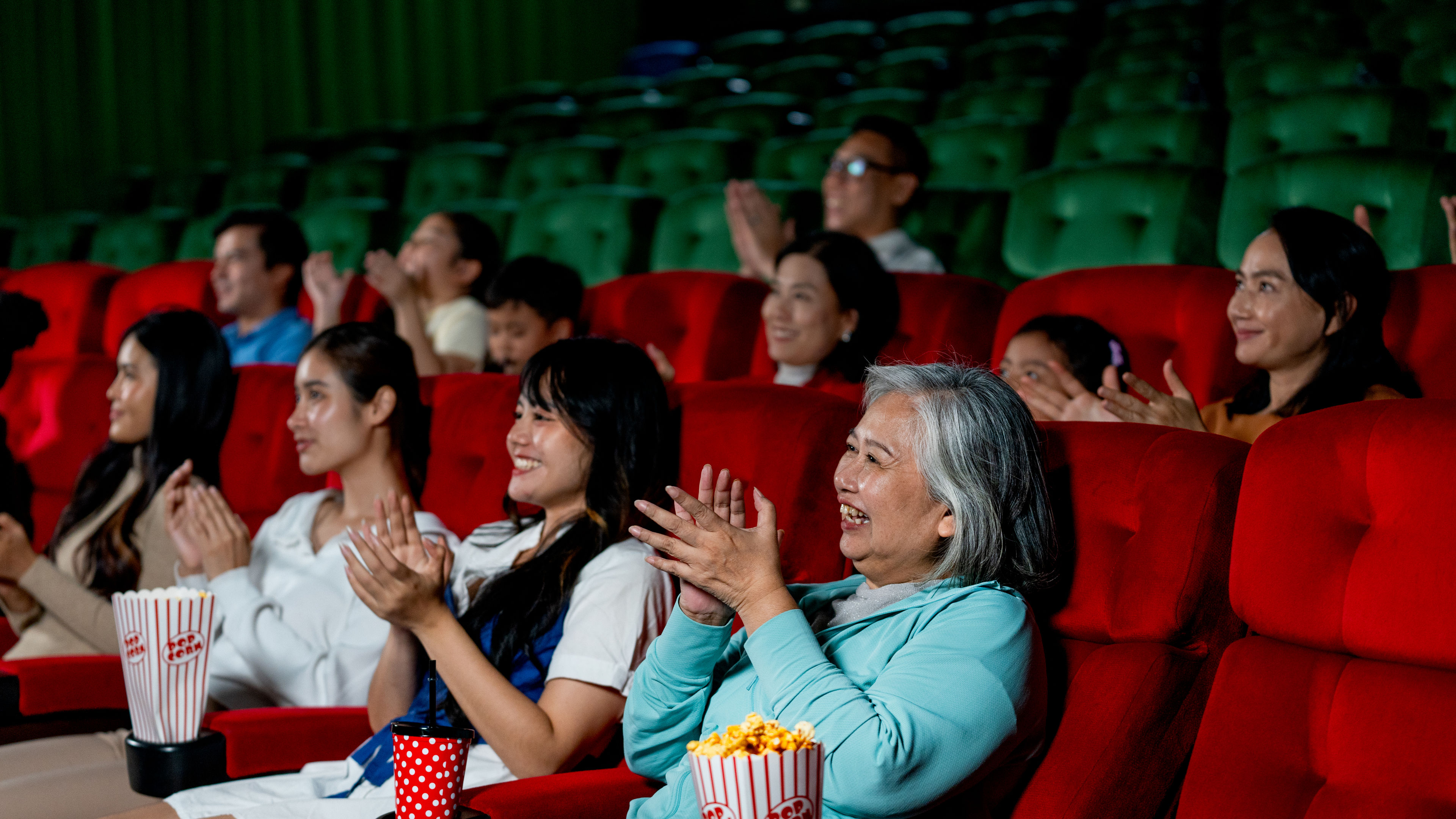 Family watching movie at Theatre