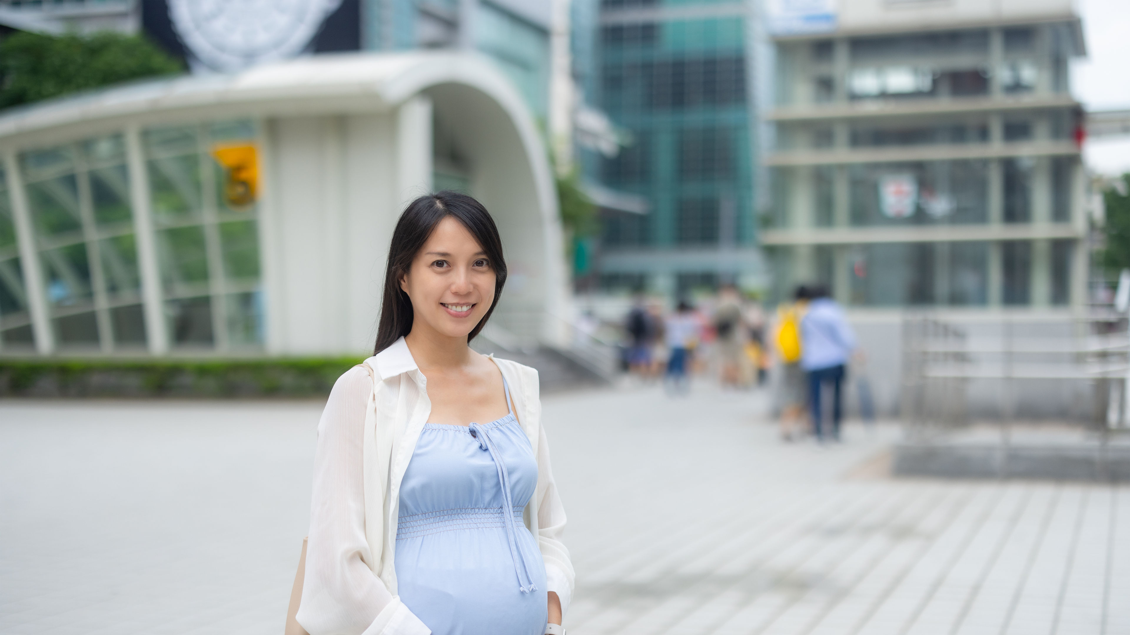Pregnant woman standing outdoors
